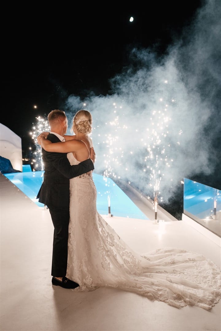 Groom and Bride enjoying fireworks after their wedding ceremony