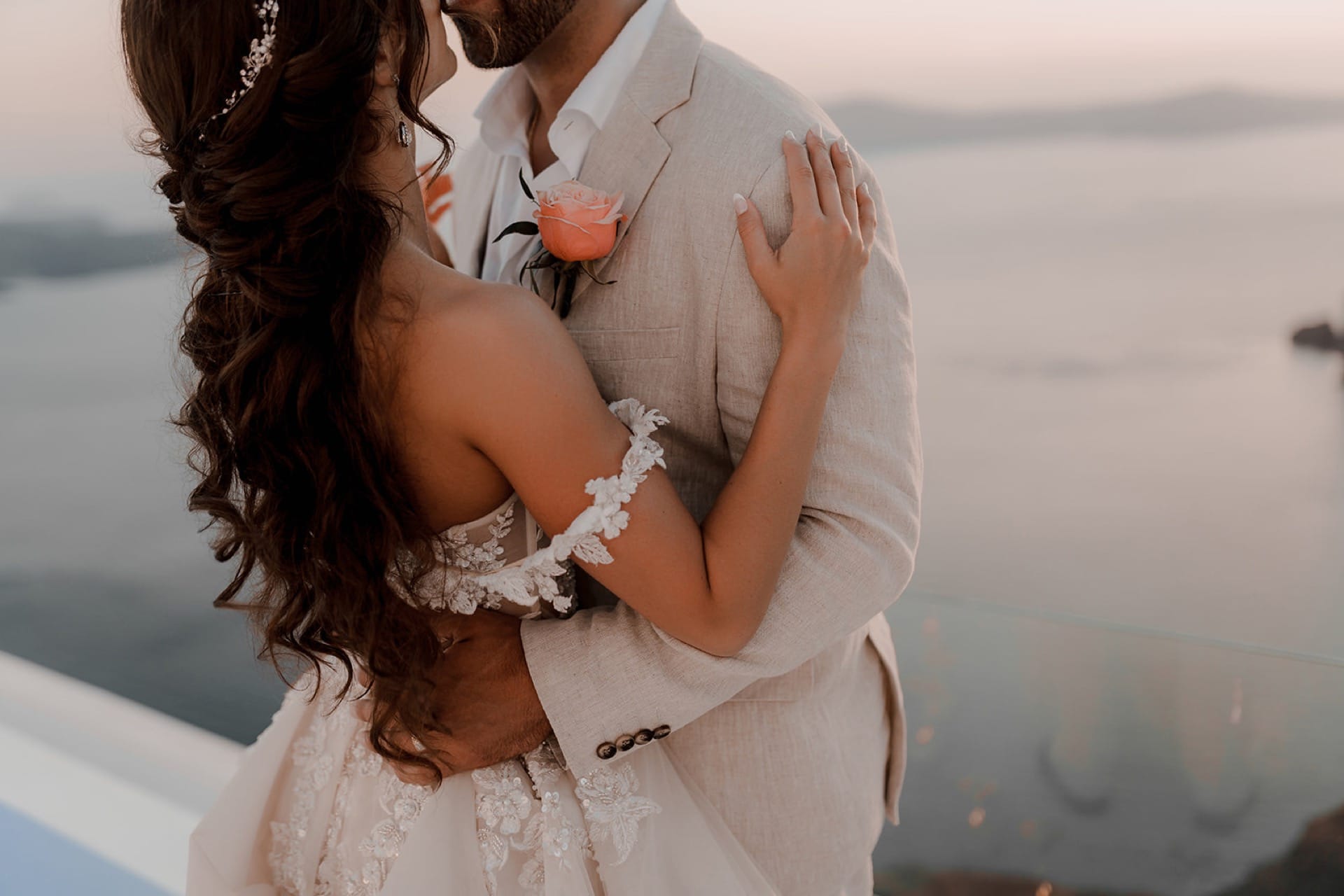 Romantic Moment of the newly married couple in front of Santorini’s Caldera