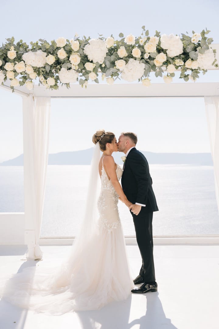 Married couple first kiss at wedding venue