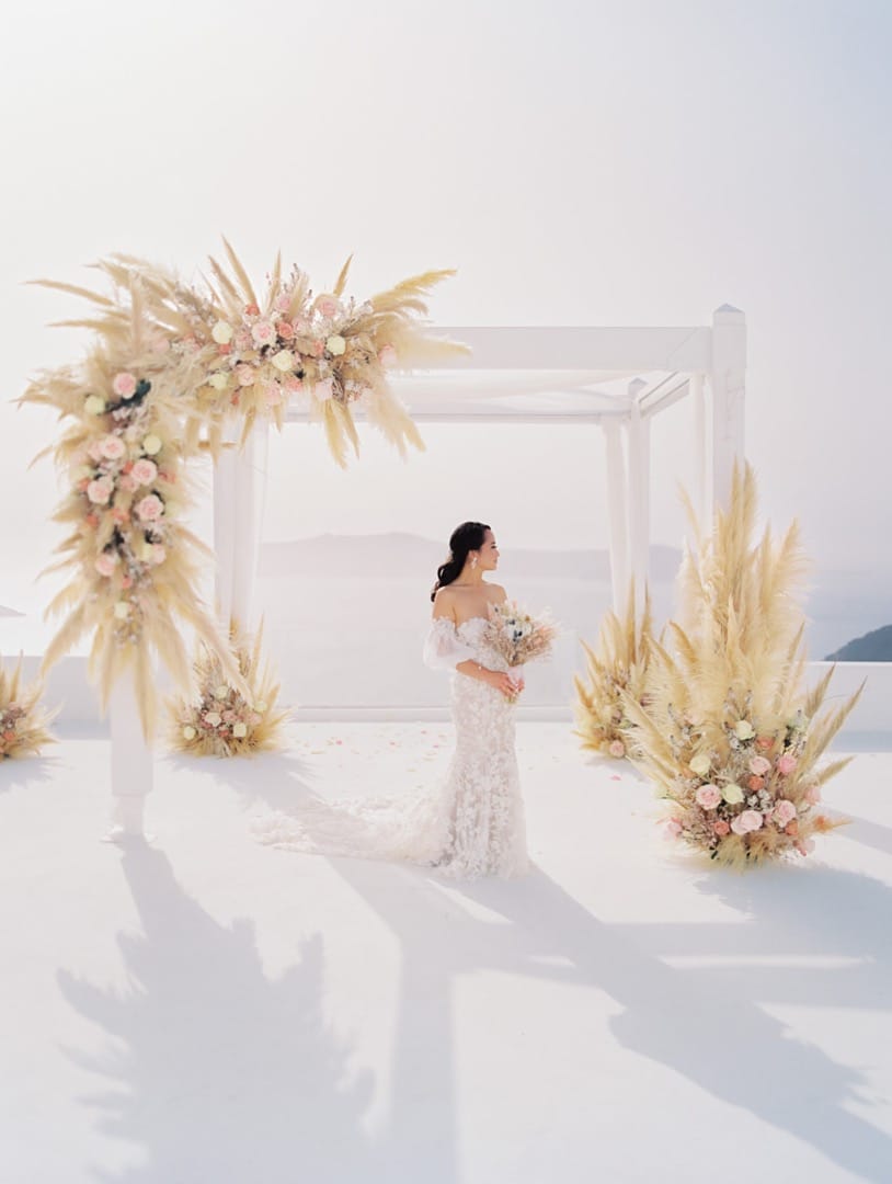 Beautiful Bride in front of decorated wedding venue